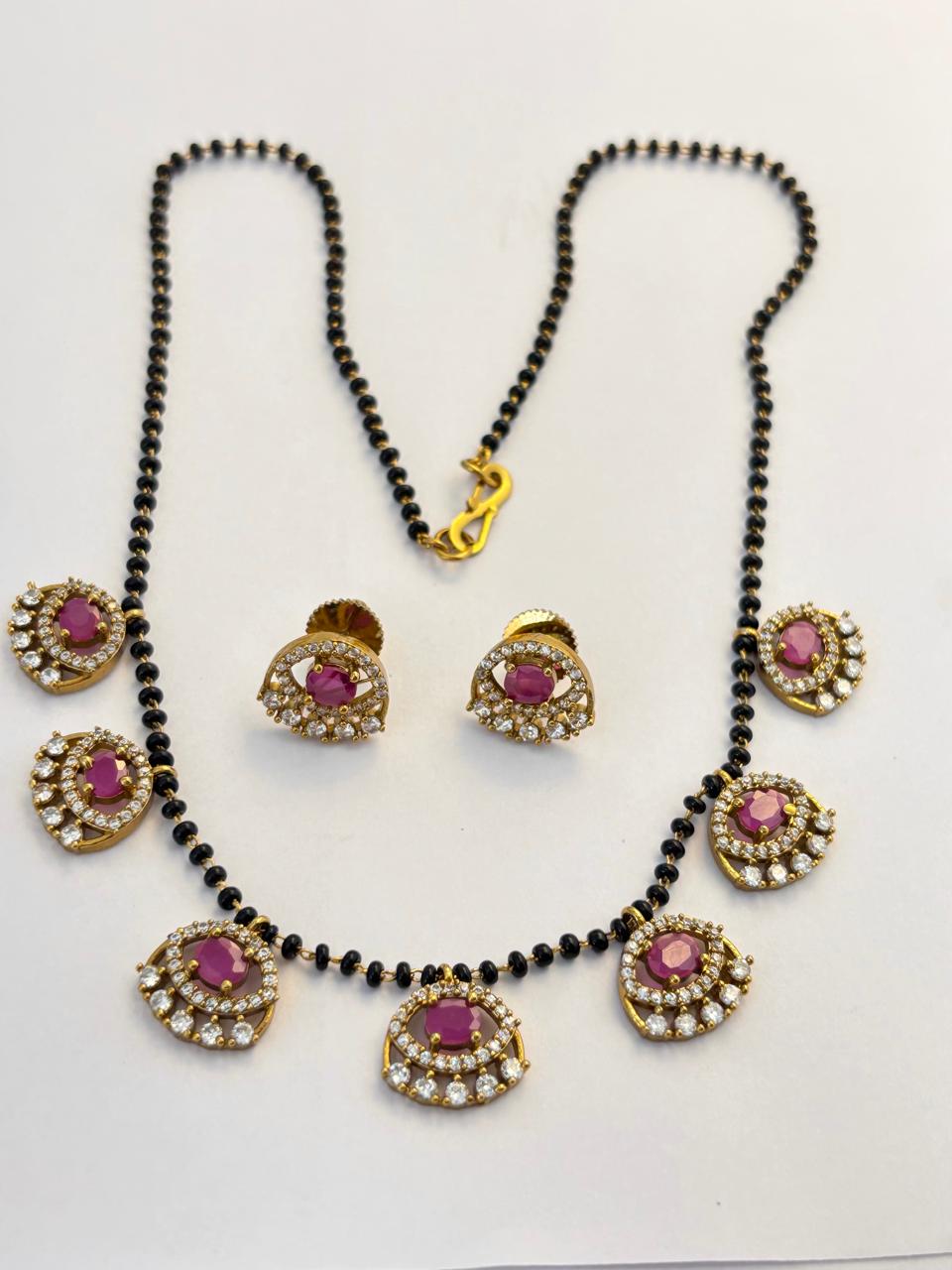 Gold-Toned Evil Eye Mangal Sutra with Seven Ruby Charms MNG015